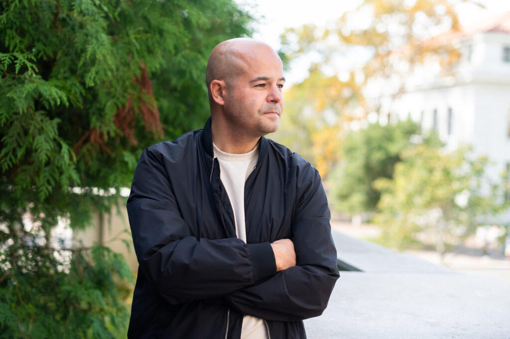 Photo of man with arms crossed